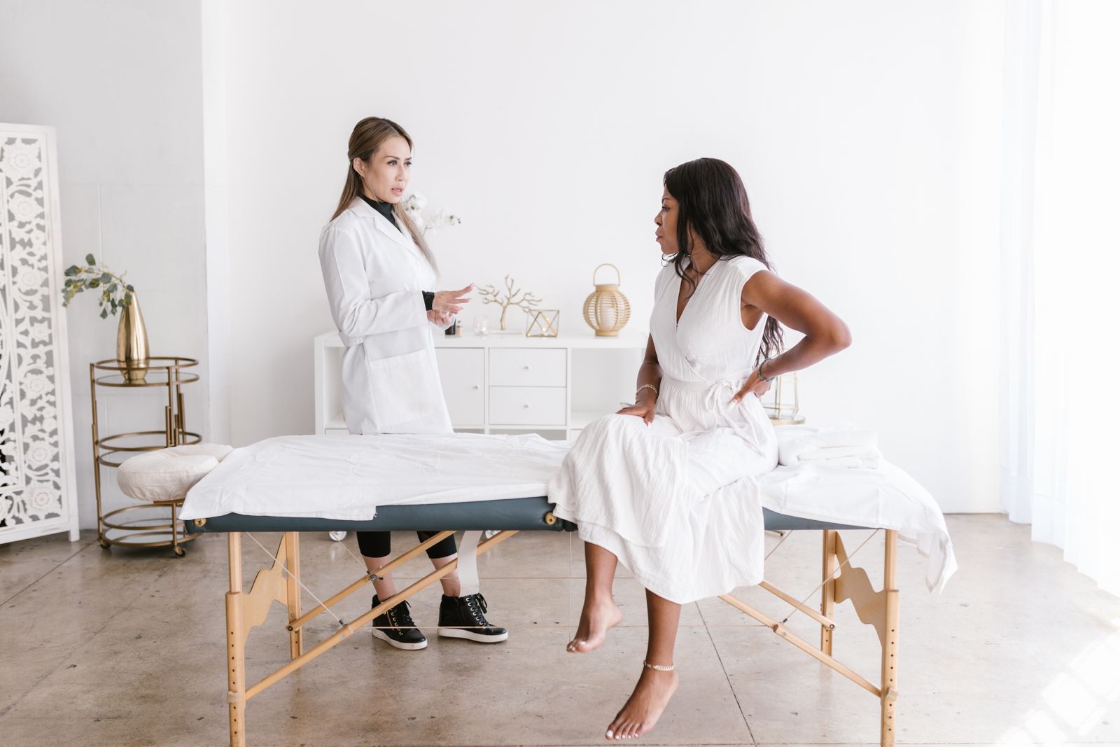 Doctor and patient talking in a bright clinic